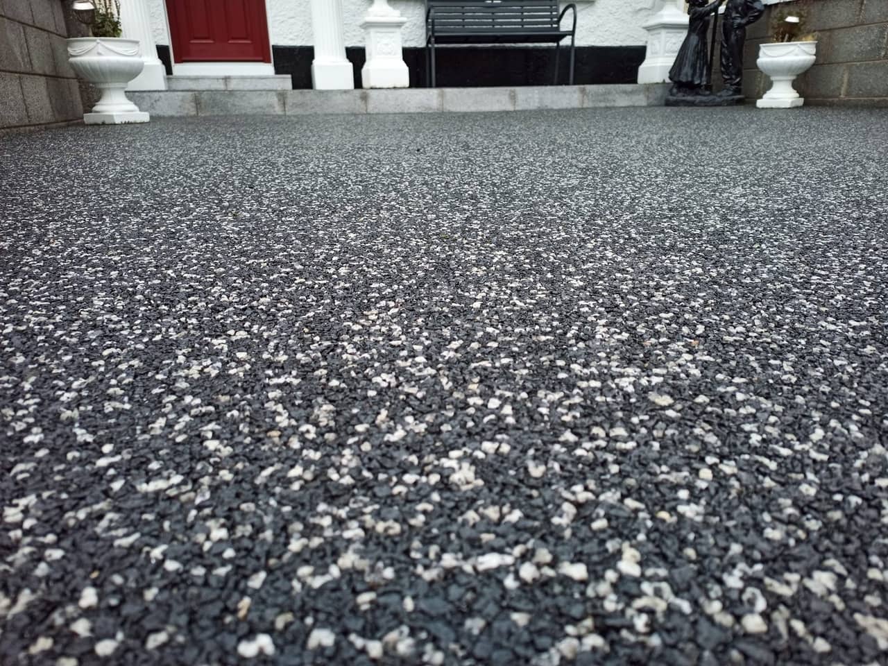 Dark resin bound patio with seating area