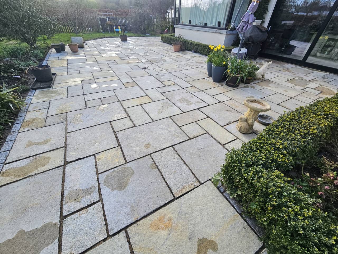 The same sandstone patio after cleaning